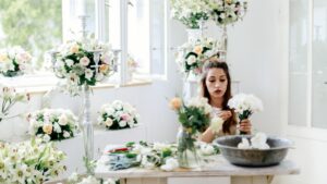Woman finishing a Vegas wedding floral arrangements